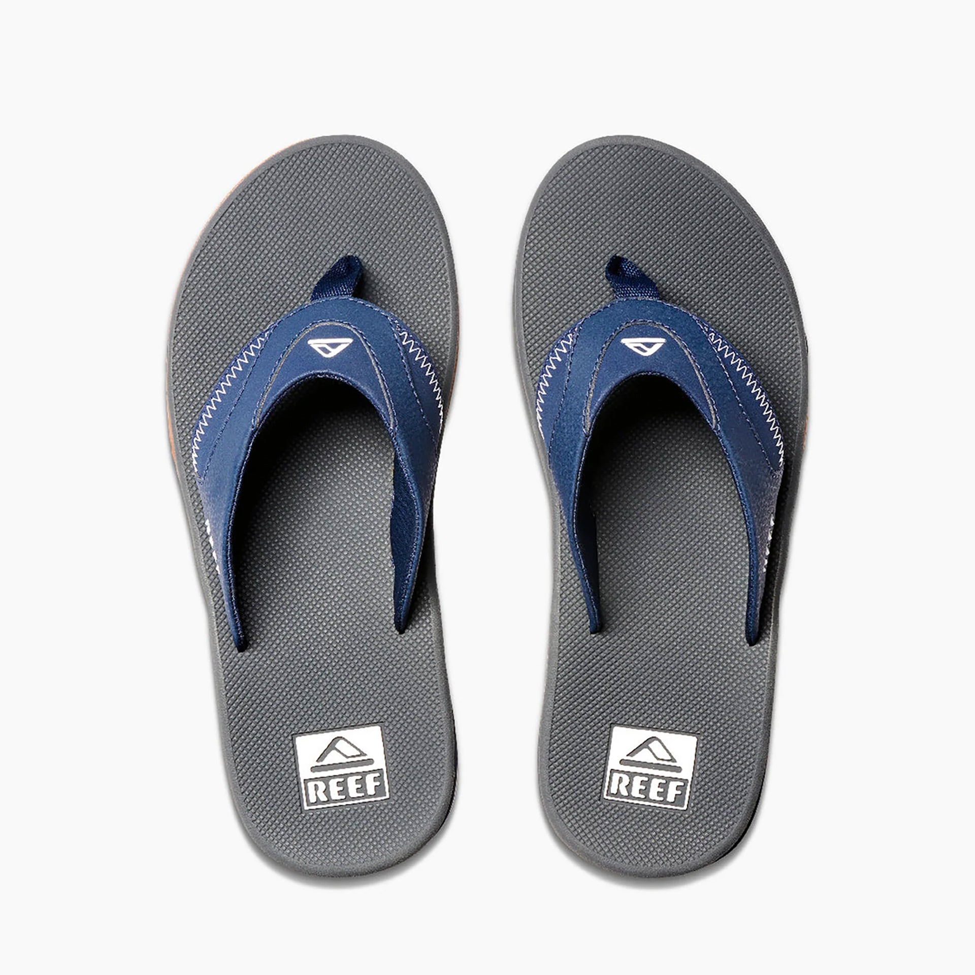 Reef mick fanning flip flops online