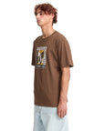 Man wearing a brown t-shirt with a logo on a white background
