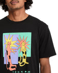 Person wearing a black Volcom t-shirt with colorful graphic design