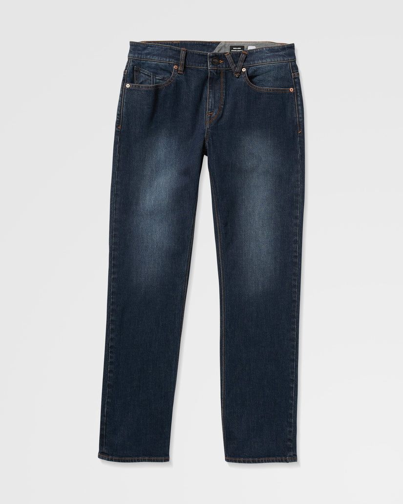 Pair of dark blue jeans on a light gray background