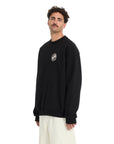 Man wearing a black sweatshirt with a logo on a white background