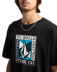 Person wearing a black Volcom t-shirt with a Volcom logo on a white background