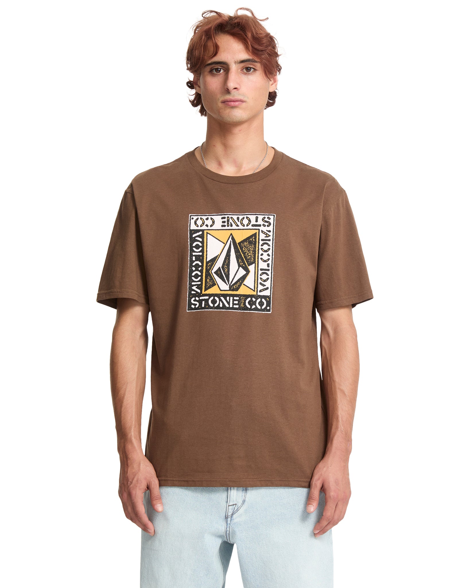 Person wearing a brown t-shirt with a logo on a white background