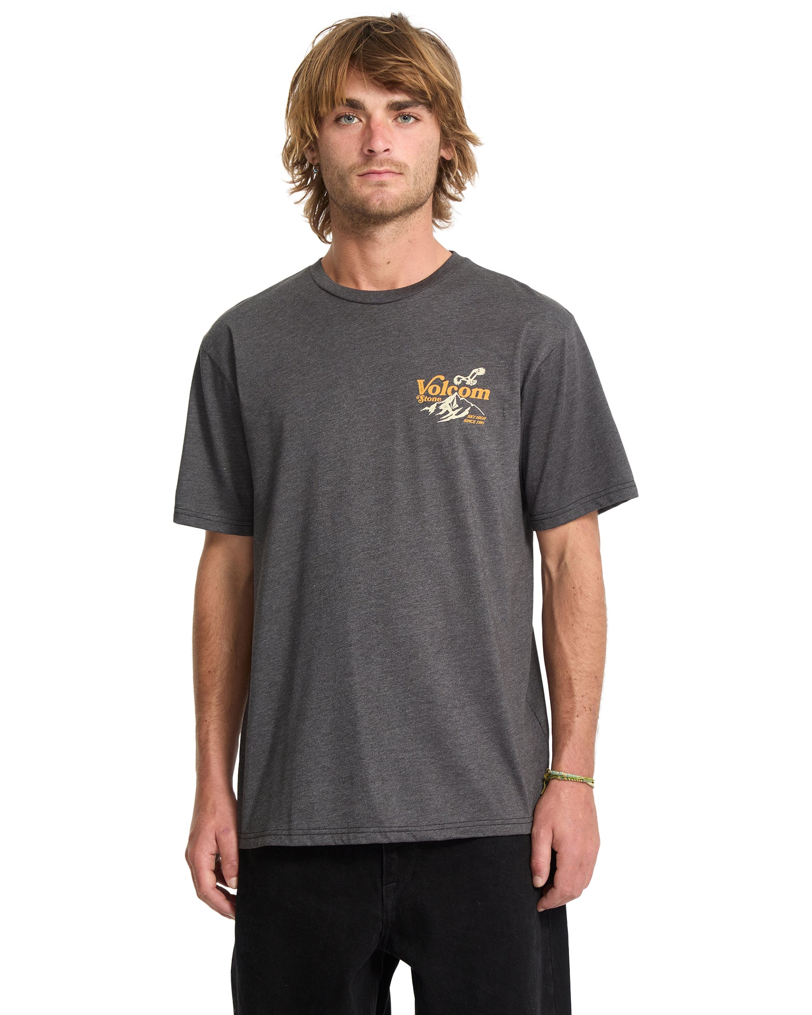 Man wearing a gray t-shirt with a logo on a white background