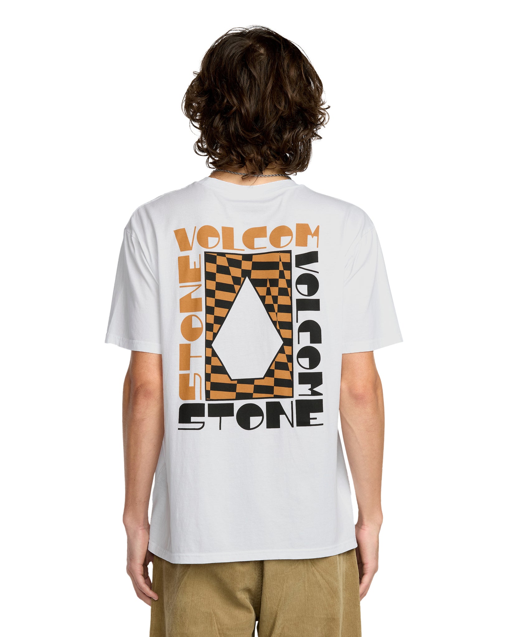 Person wearing a white t-shirt with Volcom and Stone logos on the back