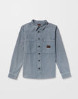 Light blue denim Volcom shirt on a white background, available at Mango Surfing.