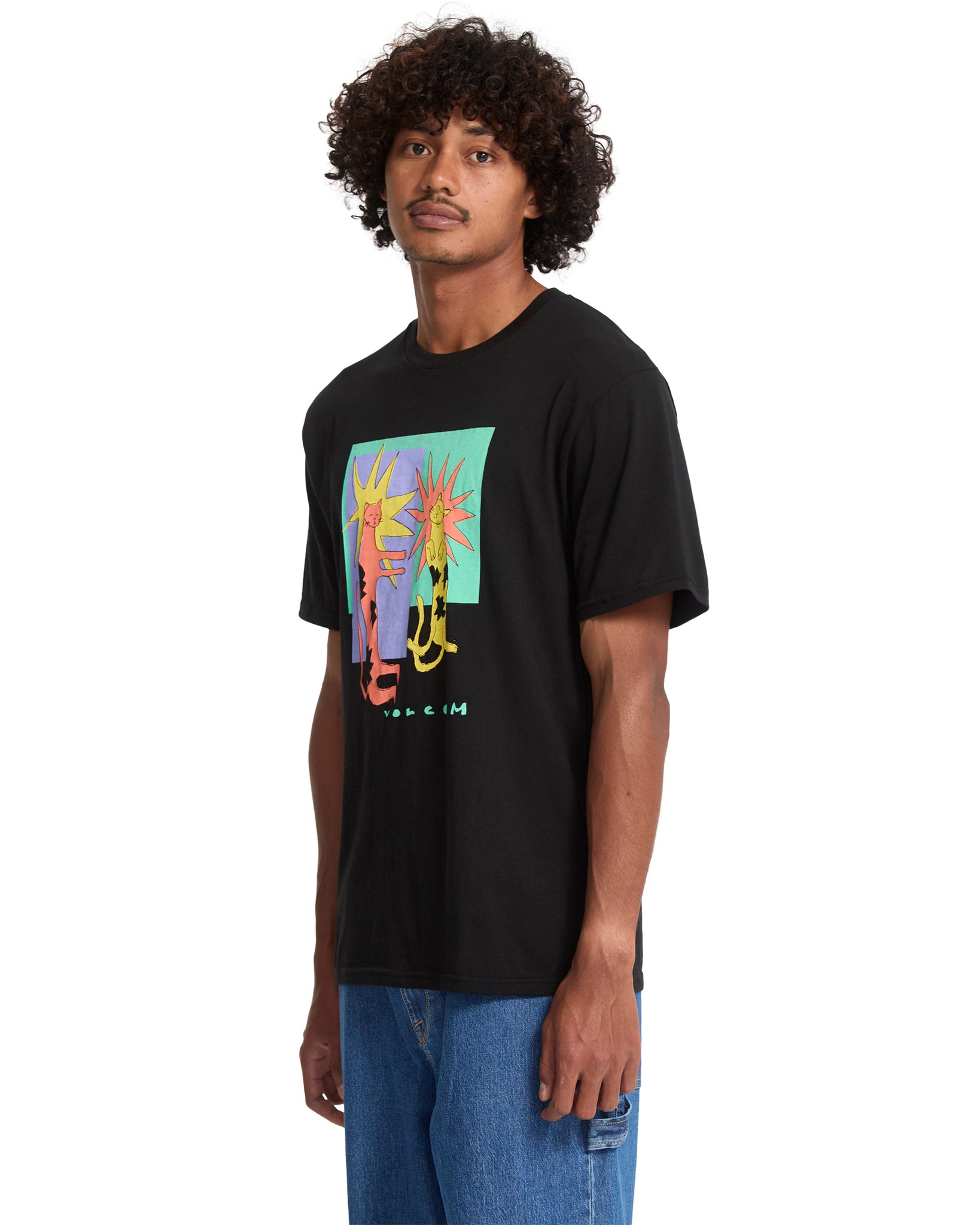 Person wearing a black t-shirt with a colorful graphic design on a white background