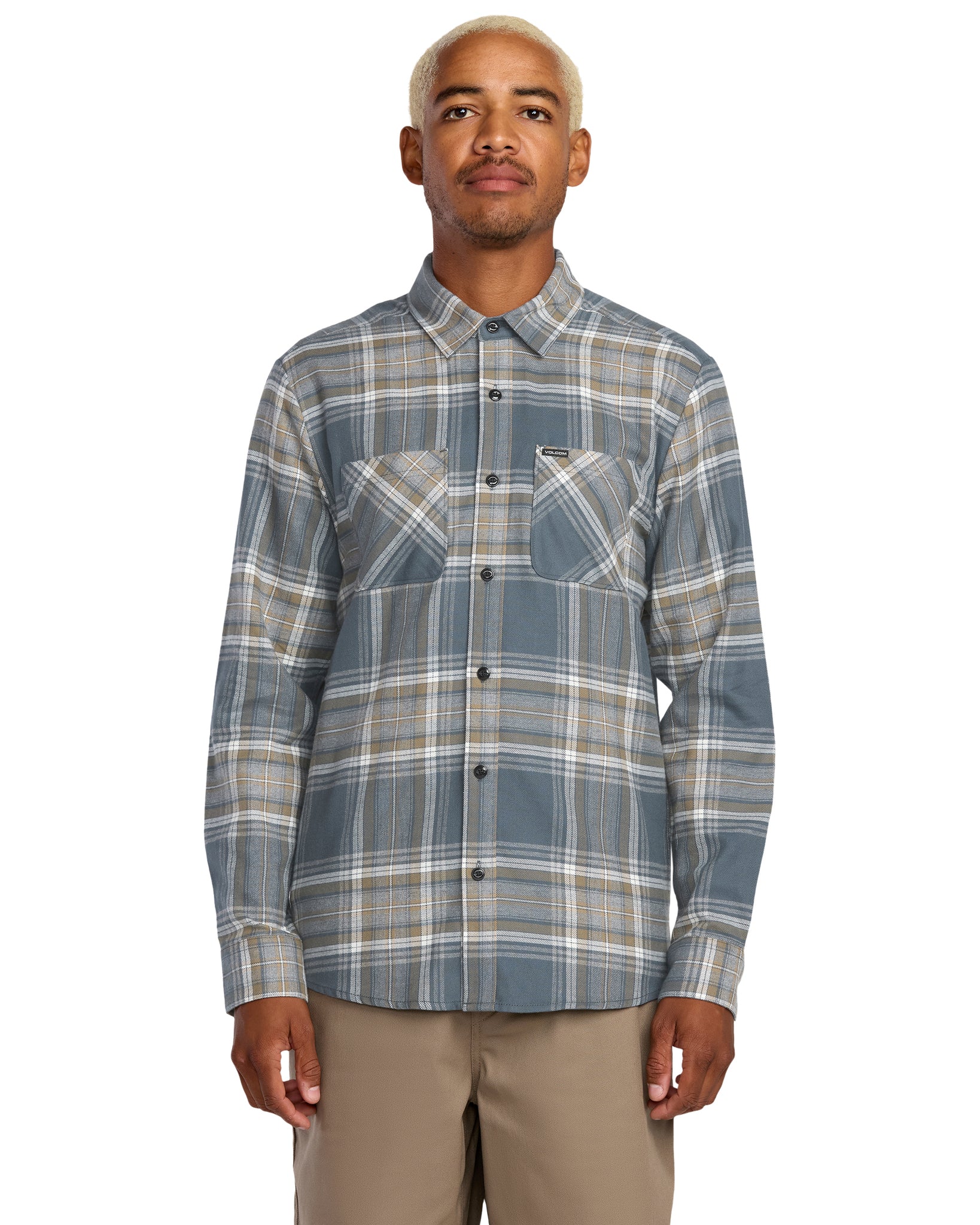 Man wearing a Volcom plaid shirt on a white background, available at Mango Surfing.