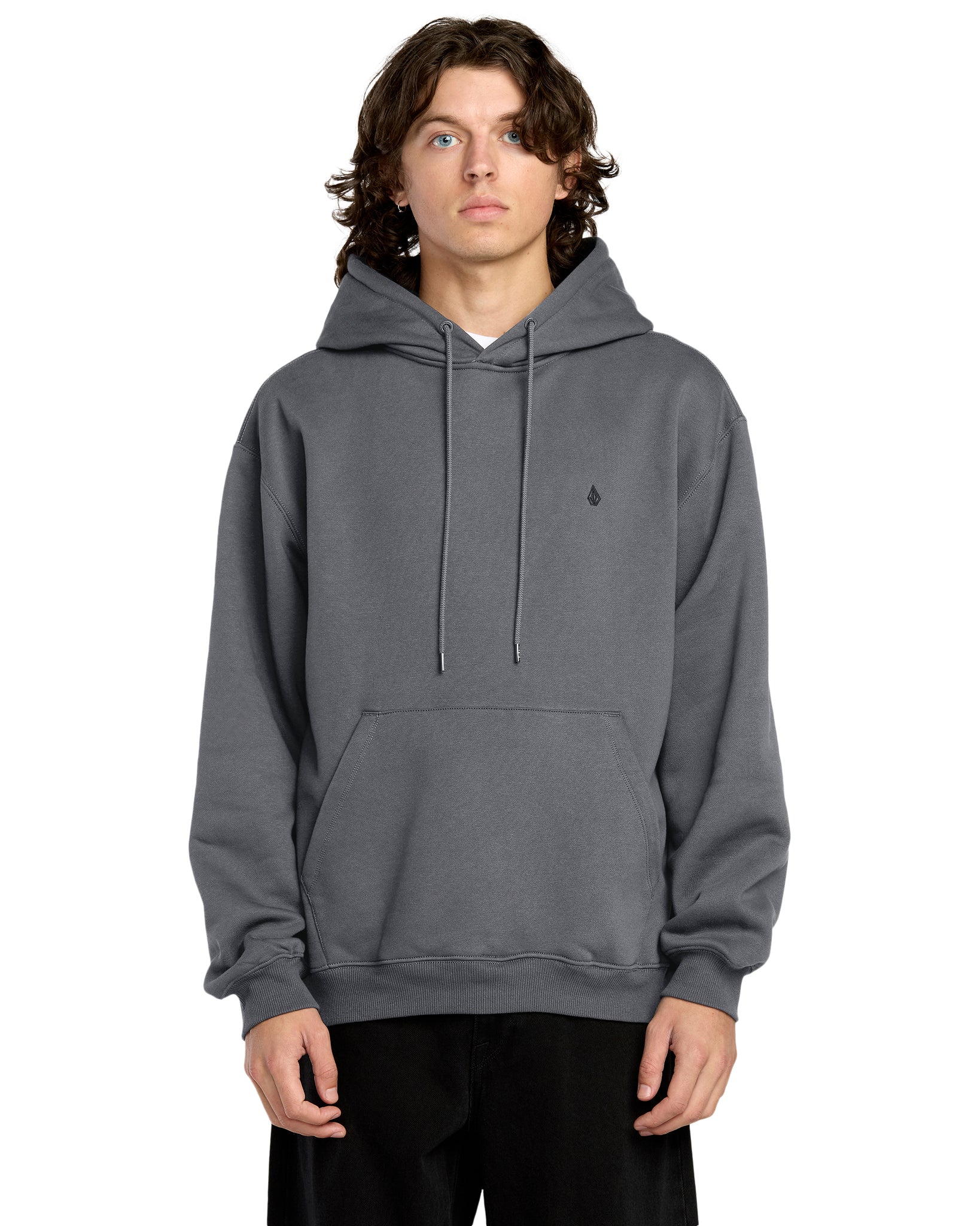 Person wearing a gray hoodie with a small logo on a white background