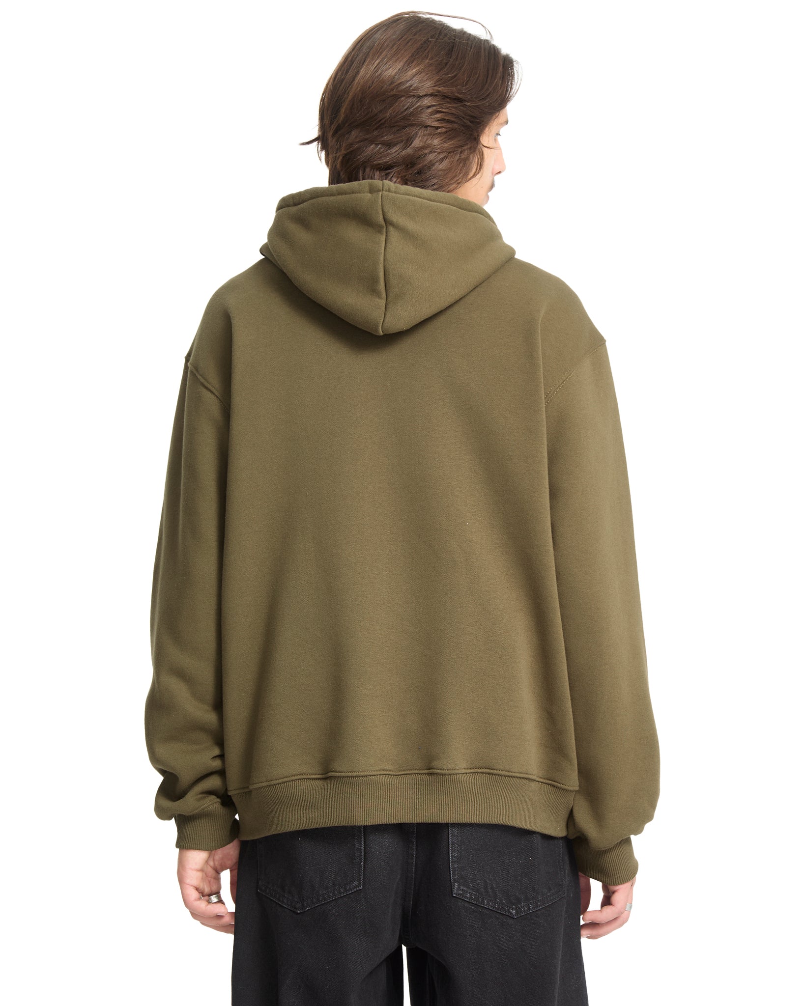 Person wearing a green hoodie from behind on a white background