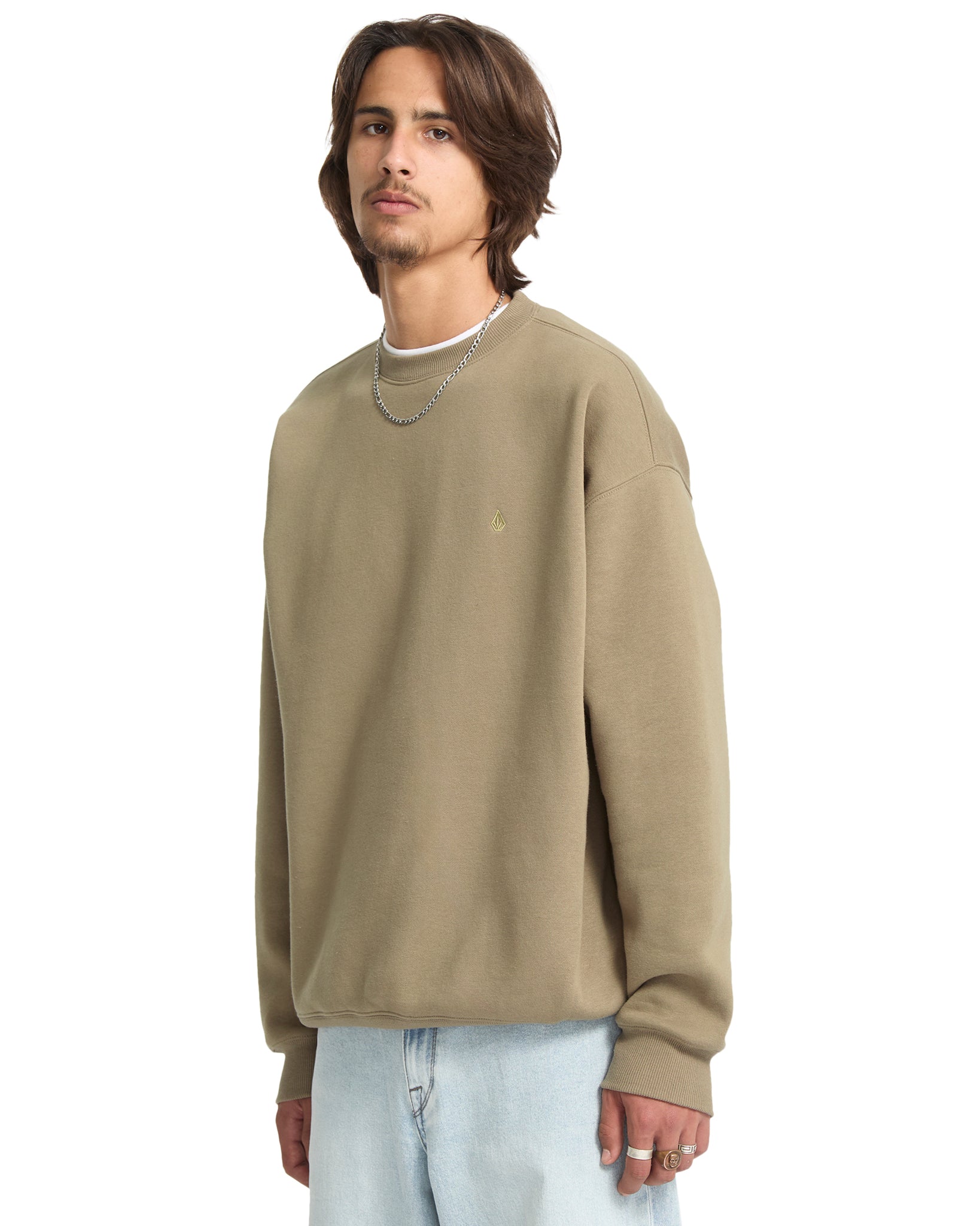 Man wearing a beige sweatshirt on a white background