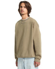 Man wearing a beige sweatshirt on a white background