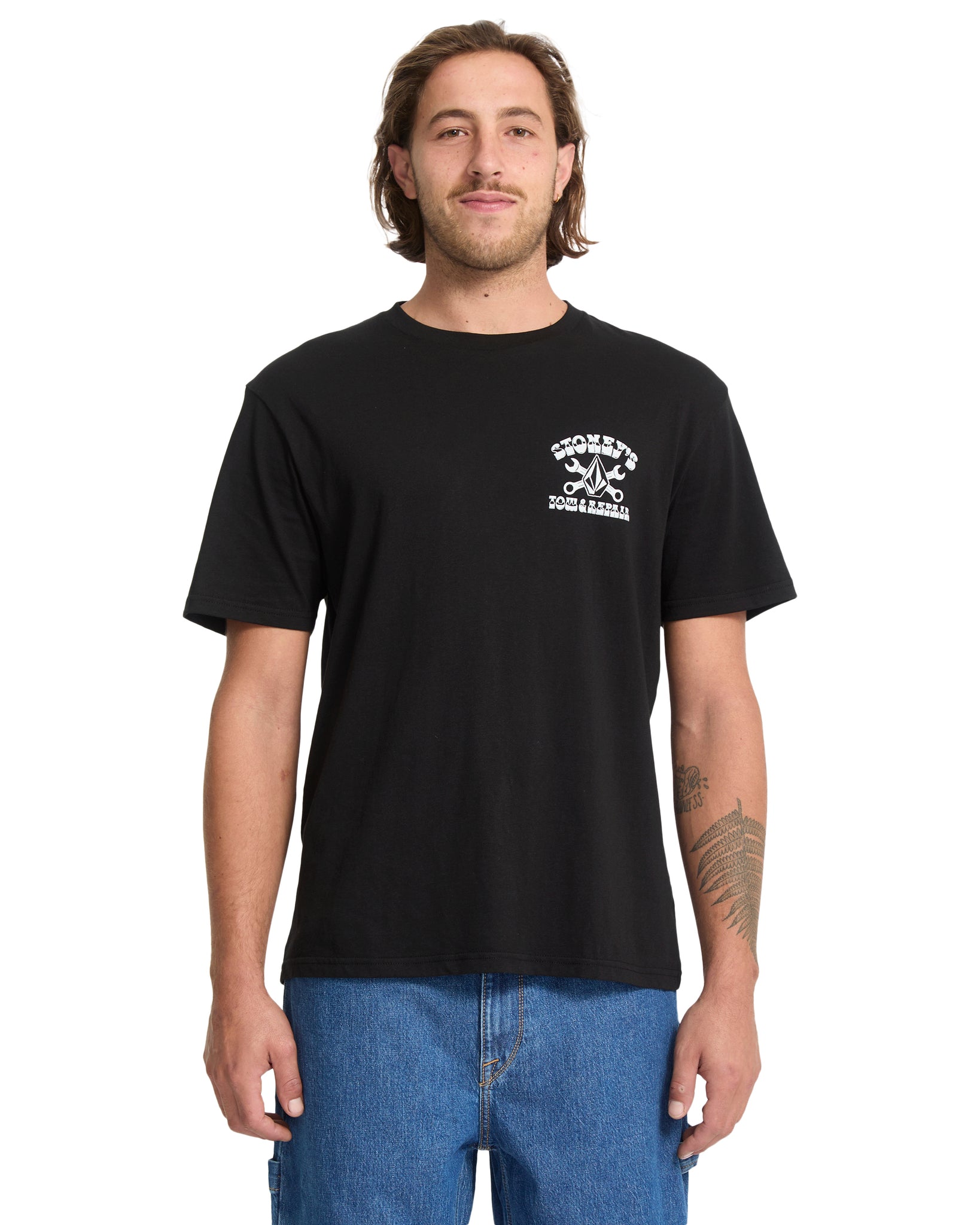 Man wearing a black t-shirt with a logo on a white background