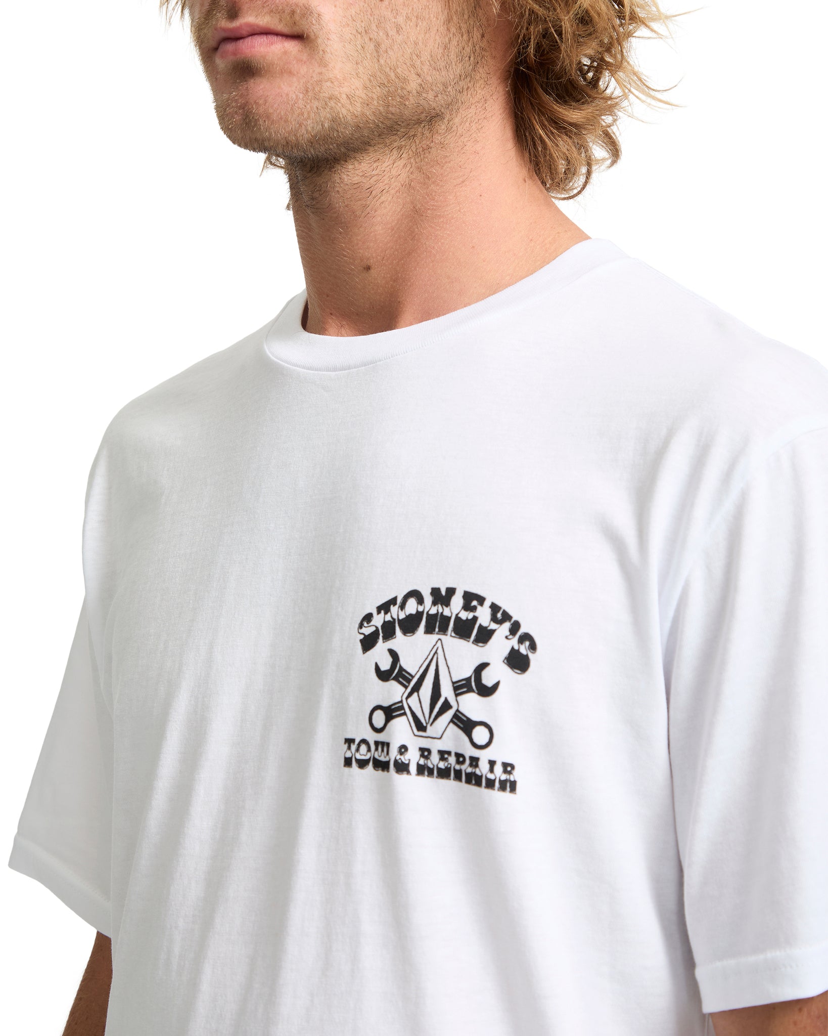 Man wearing a white t-shirt with a graphic design on a white background