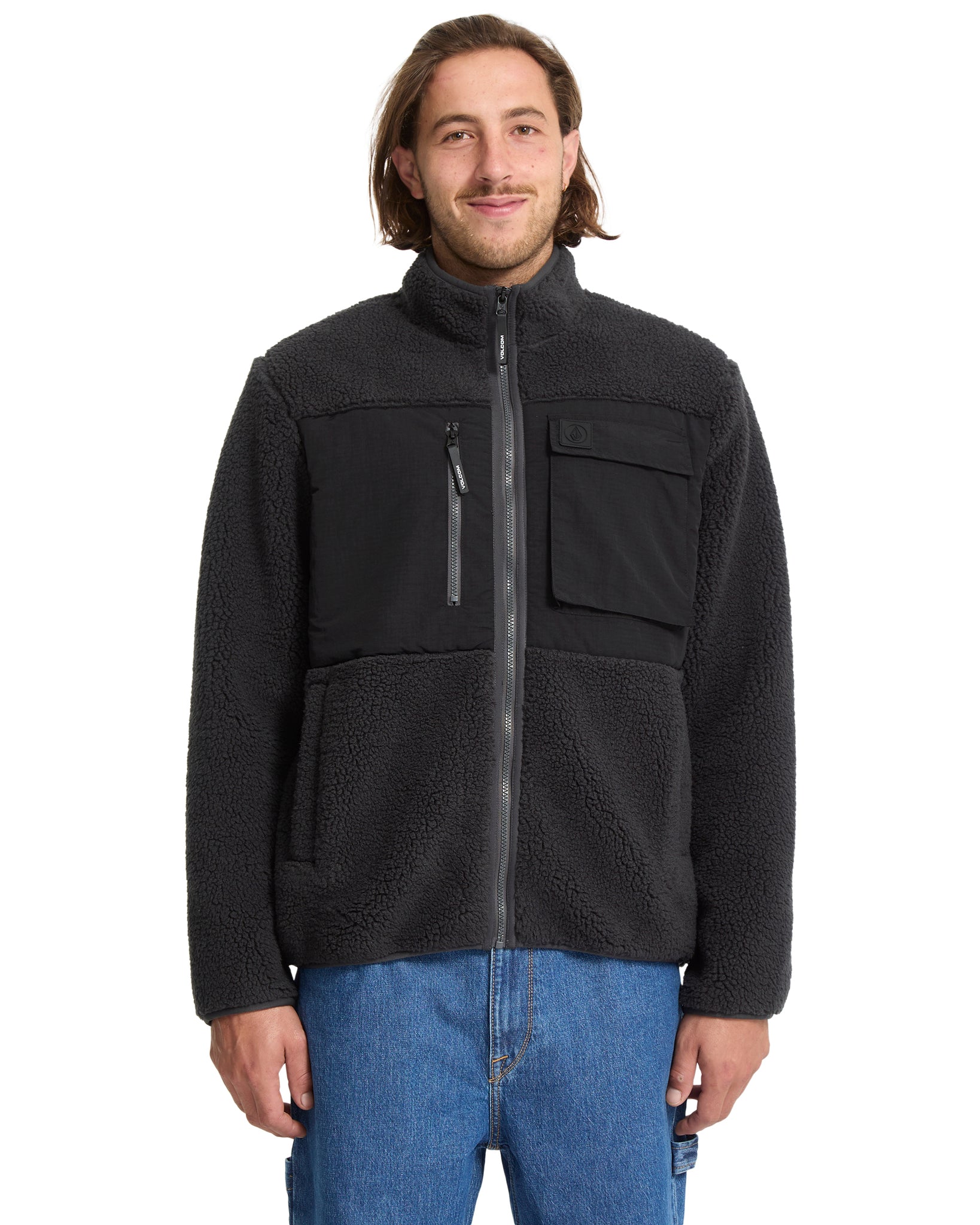 Man wearing a black fleece jacket on a white background