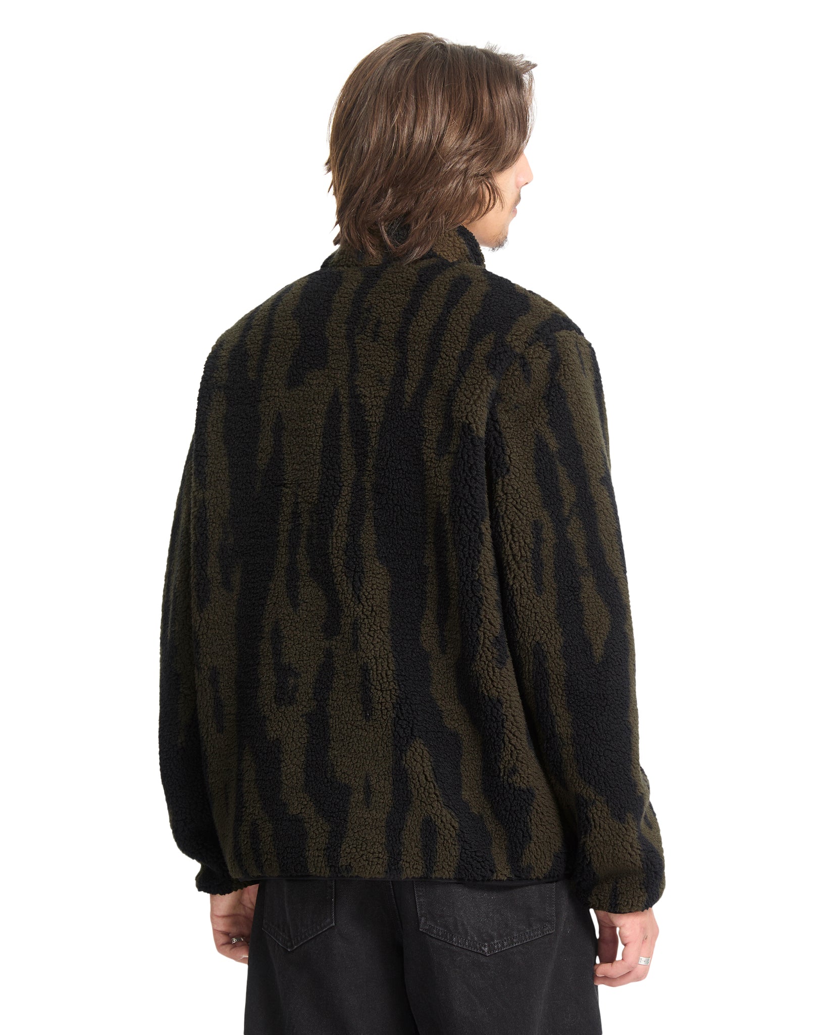 Person wearing a dark camouflage jacket on a white background