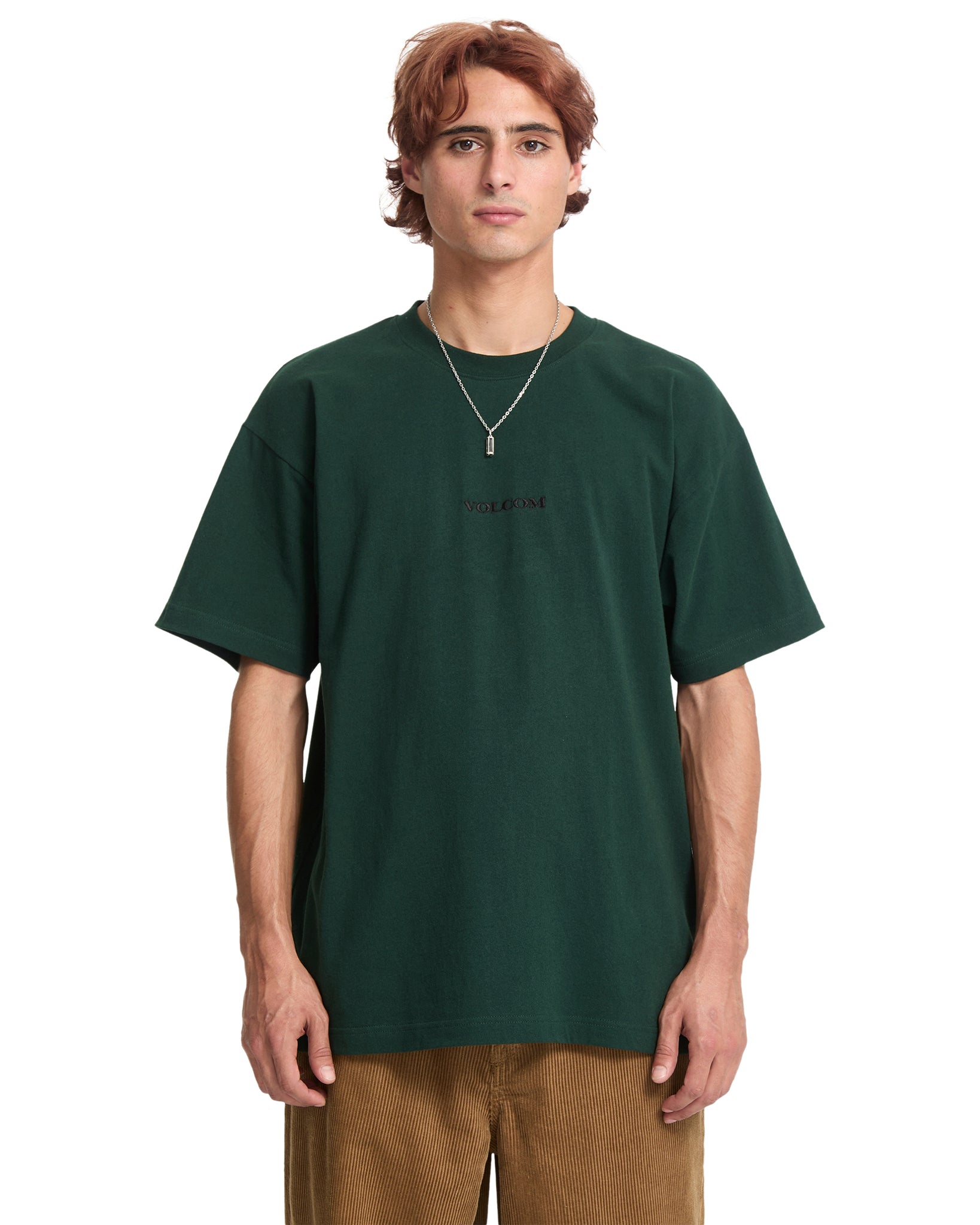Person wearing a dark green t-shirt on a white background