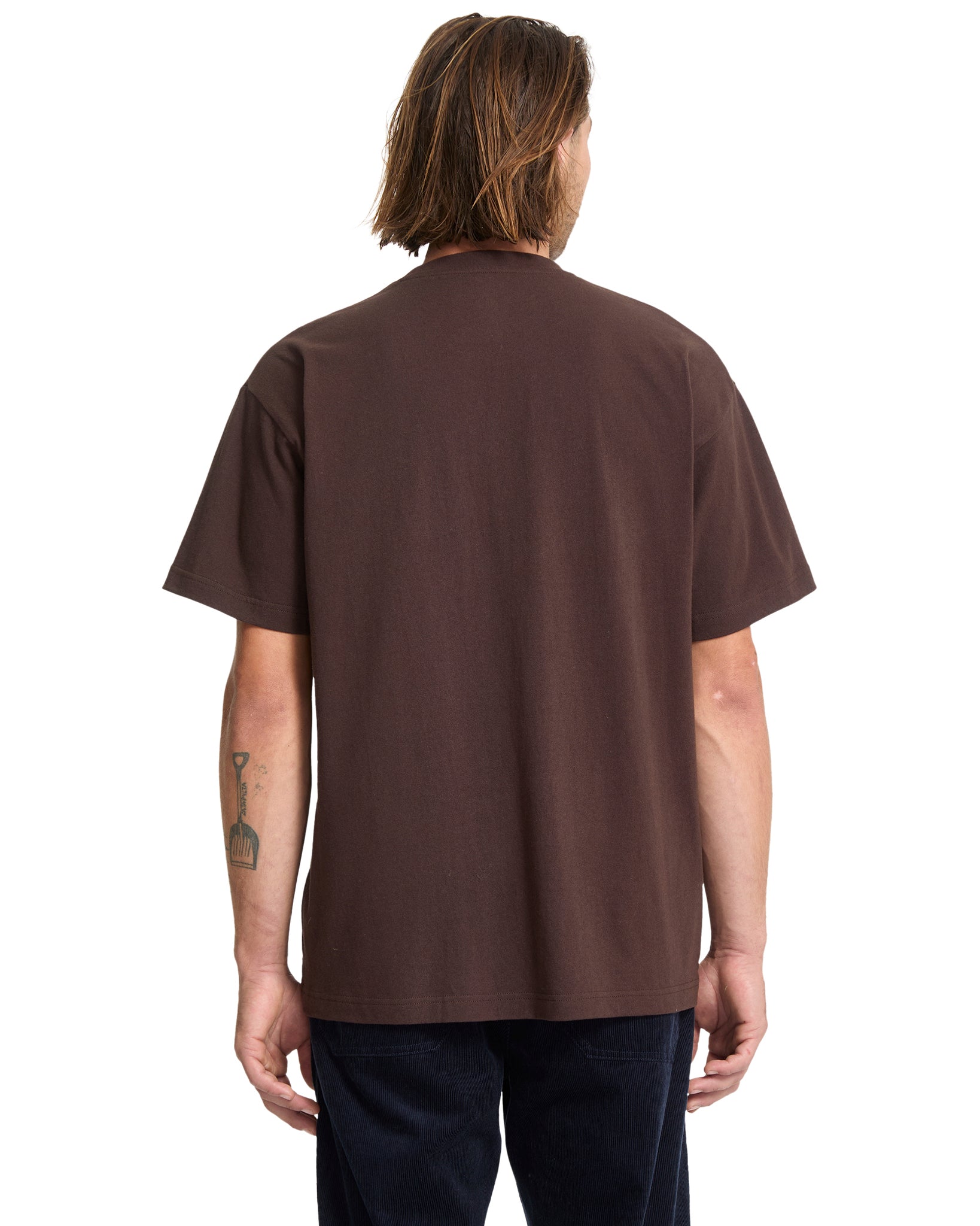 Person wearing a brown t-shirt on a white background