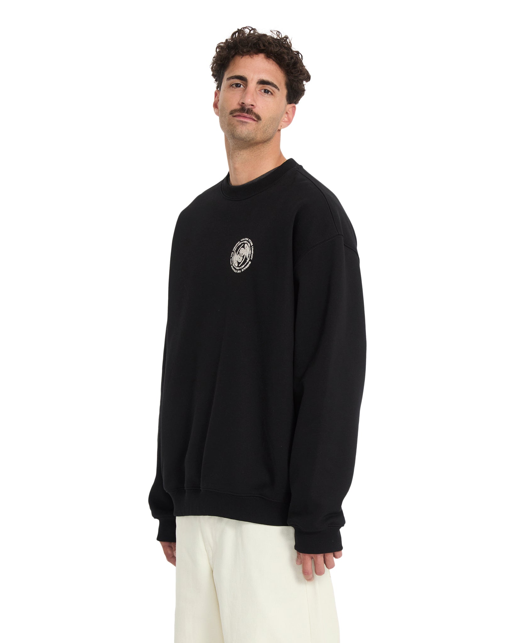 Man wearing a black sweatshirt with a logo on a white background